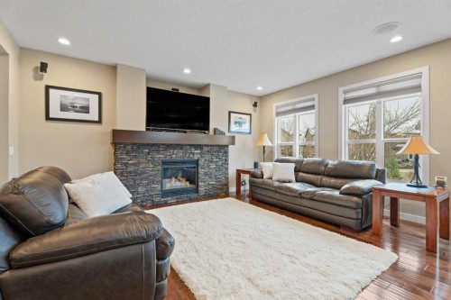 199 Cranarch Landing Se, Calgary, AB - Indoor Photo Showing Living Room With Fireplace