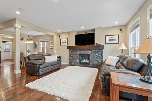199 Cranarch Landing Se, Calgary, AB - Indoor Photo Showing Living Room With Fireplace