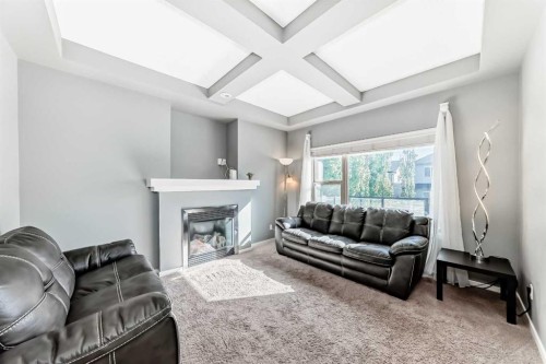 136 Sage Valley Drive Nw, Calgary, AB - Indoor Photo Showing Living Room With Fireplace