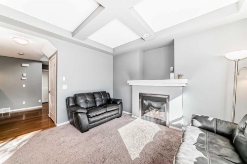 136 Sage Valley Drive Nw, Calgary, AB - Indoor Photo Showing Living Room With Fireplace