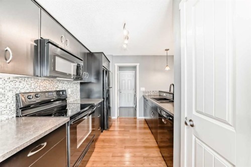 136 Sage Valley Drive Nw, Calgary, AB - Indoor Photo Showing Kitchen With Upgraded Kitchen