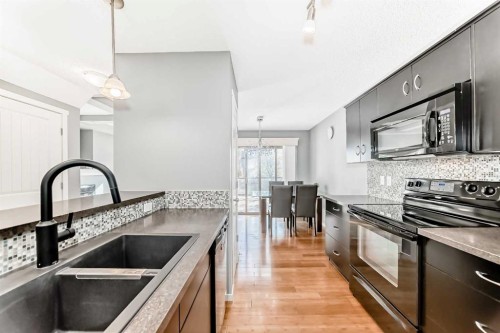 136 Sage Valley Drive Nw, Calgary, AB - Indoor Photo Showing Kitchen With Double Sink With Upgraded Kitchen