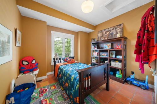 118 Riverwood Crescent Sw, Diamond Valley, AB - Indoor Photo Showing Bedroom