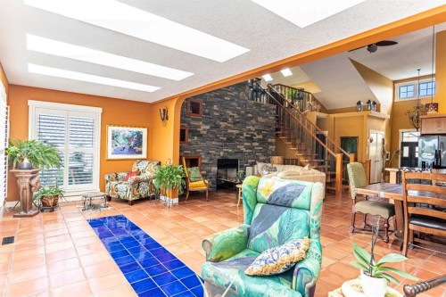 118 Riverwood Crescent Sw, Diamond Valley, AB - Indoor With Fireplace