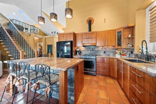 118 Riverwood Crescent Sw, Diamond Valley, AB - Indoor Photo Showing Kitchen With Double Sink With Upgraded Kitchen