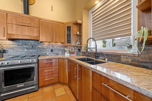 118 Riverwood Crescent Sw, Diamond Valley, AB - Indoor Photo Showing Kitchen With Double Sink With Upgraded Kitchen