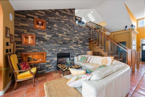 118 Riverwood Crescent Sw, Diamond Valley, AB - Indoor With Fireplace