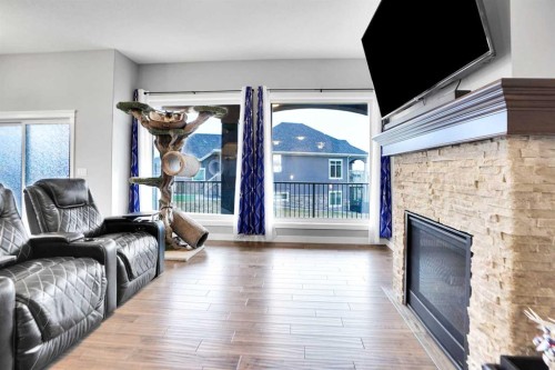 3 Muirfield Close, Lyalta, AB - Indoor Photo Showing Living Room With Fireplace