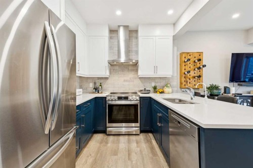 132 Crestridge Common Sw, Calgary, AB - Indoor Photo Showing Kitchen With Double Sink With Upgraded Kitchen