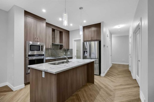 320 Nolancrest Circle Nw, Calgary, AB - Indoor Photo Showing Kitchen With Double Sink With Upgraded Kitchen