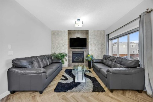 320 Nolancrest Circle Nw, Calgary, AB - Indoor Photo Showing Living Room With Fireplace