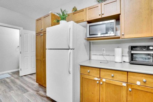 1004-720 Willowbrook Road Nw, Airdrie, AB - Indoor Photo Showing Kitchen