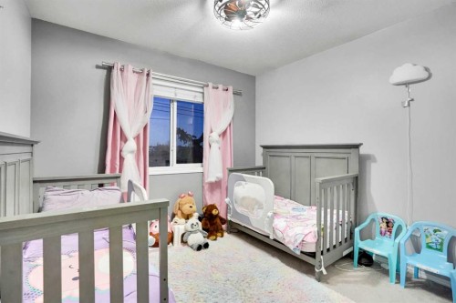 1004-720 Willowbrook Road Nw, Airdrie, AB - Indoor Photo Showing Bedroom