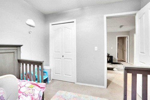 1004-720 Willowbrook Road Nw, Airdrie, AB - Indoor Photo Showing Bedroom