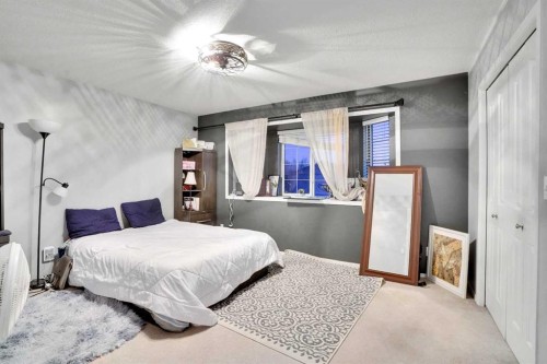 1004-720 Willowbrook Road Nw, Airdrie, AB - Indoor Photo Showing Bedroom