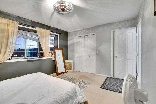 1004-720 Willowbrook Road Nw, Airdrie, AB - Indoor Photo Showing Bedroom