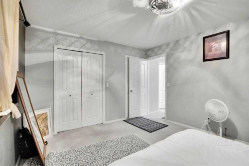 1004-720 Willowbrook Road Nw, Airdrie, AB - Indoor Photo Showing Bedroom