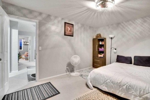 1004-720 Willowbrook Road Nw, Airdrie, AB - Indoor Photo Showing Bedroom