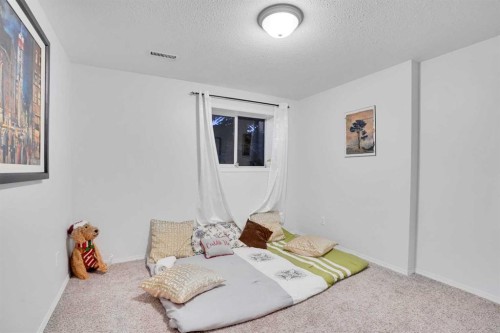 1004-720 Willowbrook Road Nw, Airdrie, AB - Indoor Photo Showing Bedroom