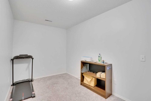 1004-720 Willowbrook Road Nw, Airdrie, AB - Indoor Photo Showing Other Room