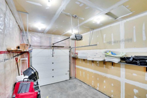 1004-720 Willowbrook Road Nw, Airdrie, AB - Indoor Photo Showing Garage