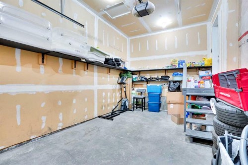 1004-720 Willowbrook Road Nw, Airdrie, AB - Indoor Photo Showing Garage
