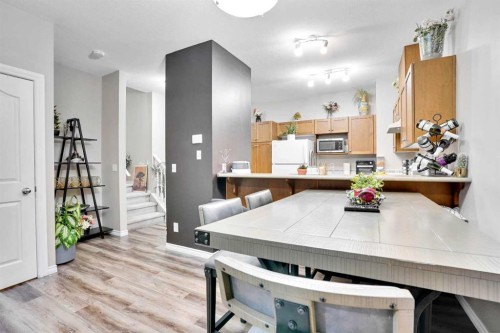 1004-720 Willowbrook Road Nw, Airdrie, AB - Indoor Photo Showing Dining Room