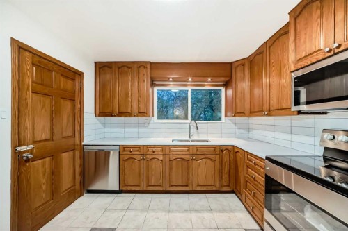 5924 Centre Street Ne, Calgary, AB - Indoor Photo Showing Kitchen With Double Sink