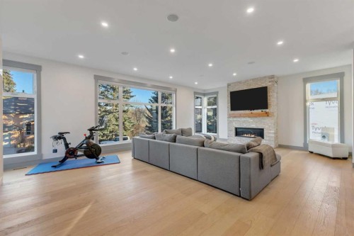 30 Roselawn Crescent Nw, Calgary, AB - Indoor Photo Showing Living Room With Fireplace