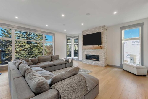 30 Roselawn Crescent Nw, Calgary, AB - Indoor Photo Showing Living Room With Fireplace