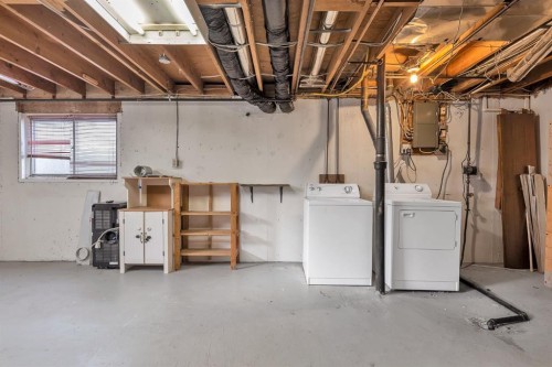 57 & 59 Dalton Bay Nw, Calgary, AB - Indoor Photo Showing Laundry Room