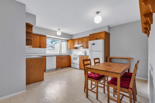 57 & 59 Dalton Bay Nw, Calgary, AB - Indoor Photo Showing Kitchen