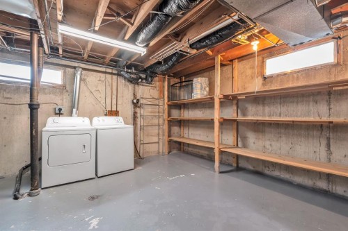 57 & 59 Dalton Bay Nw, Calgary, AB - Indoor Photo Showing Laundry Room