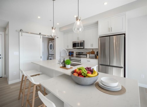 7202-1802 Mahogany Boulevard Se, Calgary, AB - Indoor Photo Showing Kitchen With Upgraded Kitchen