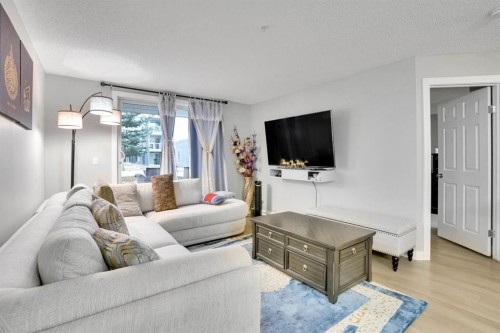 1111-2280 68 Street Ne, Calgary, AB - Indoor Photo Showing Living Room