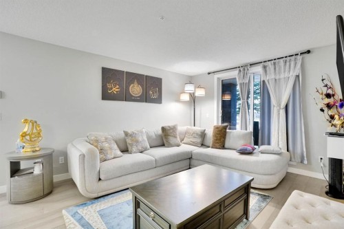 1111-2280 68 Street Ne, Calgary, AB - Indoor Photo Showing Living Room