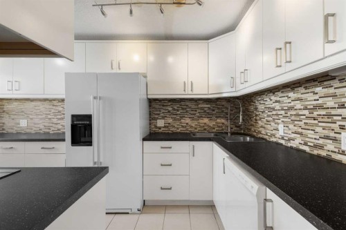 9-5400 Dalhousie Drive, Calgary, AB - Indoor Photo Showing Kitchen With Upgraded Kitchen