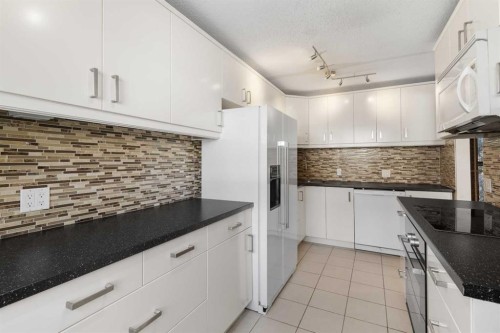 9-5400 Dalhousie Drive, Calgary, AB - Indoor Photo Showing Kitchen With Upgraded Kitchen