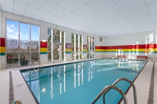 9-5400 Dalhousie Drive, Calgary, AB - Indoor Photo Showing Other Room With In Ground Pool
