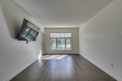 107-25 Aspenmont Heights Sw, Calgary, AB - Indoor Photo Showing Other Room