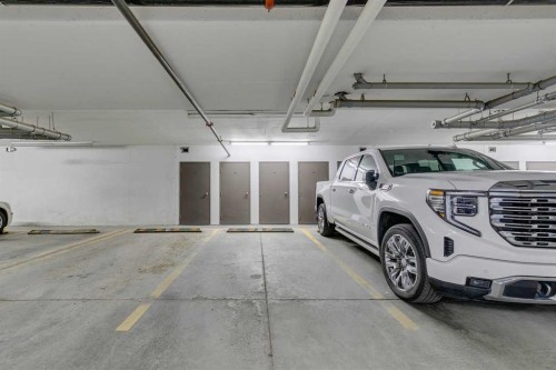 107-25 Aspenmont Heights Sw, Calgary, AB - Indoor Photo Showing Garage