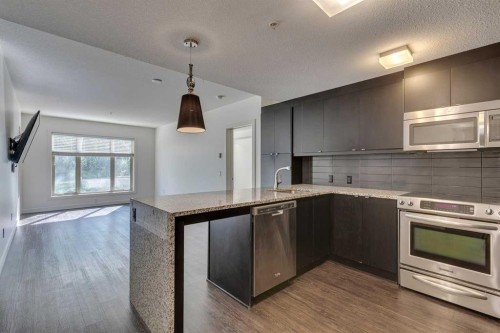 107-25 Aspenmont Heights Sw, Calgary, AB - Indoor Photo Showing Kitchen With Upgraded Kitchen