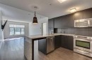 107-25 Aspenmont Heights Sw, Calgary, AB  - Indoor Photo Showing Kitchen With Upgraded Kitchen 