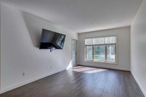 107-25 Aspenmont Heights Sw, Calgary, AB - Indoor Photo Showing Other Room