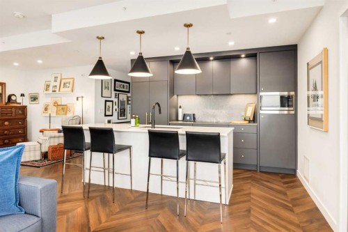 601-8445 Broadcast Avenue Sw, Calgary, AB - Indoor Photo Showing Kitchen With Upgraded Kitchen