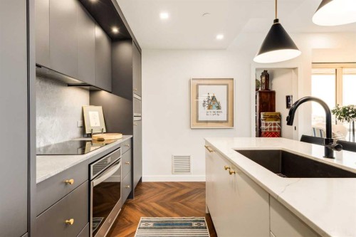 601-8445 Broadcast Avenue Sw, Calgary, AB - Indoor Photo Showing Kitchen With Upgraded Kitchen