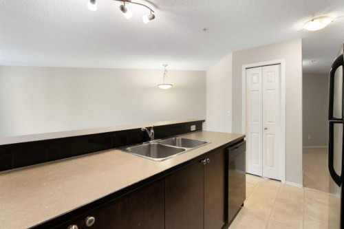 3112-16969 24 Street Sw, Calgary, AB - Indoor Photo Showing Kitchen With Double Sink