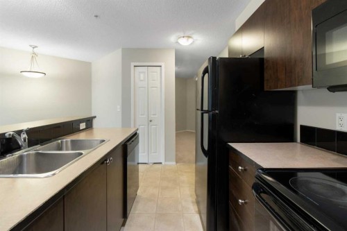 3112-16969 24 Street Sw, Calgary, AB - Indoor Photo Showing Kitchen With Double Sink