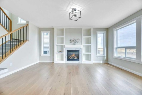 828 Edgefield Street, Strathmore, AB - Indoor Photo Showing Living Room With Fireplace