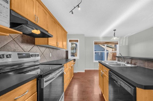 249 Covemeadow Road Ne, Calgary, AB - Indoor Photo Showing Kitchen With Double Sink